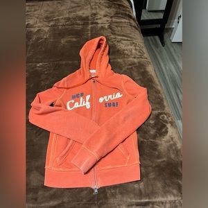 Woman’s size small heathered Orange Hollister jacket with hood